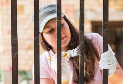 Girl Is Painting Metal Fence With A Brush Stock Image Image Of