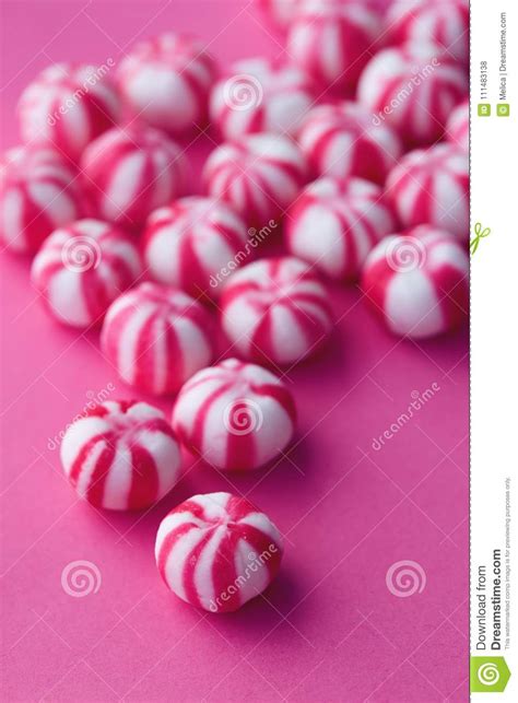 Pink And White Striped Sweets On Pink Background Stock Photo Image