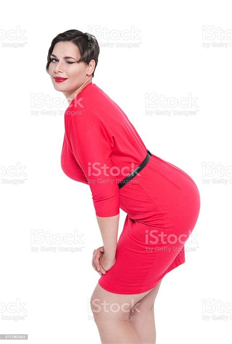 Beautiful Plus Size Woman In Red Dress Winking Isolated Stock Photo