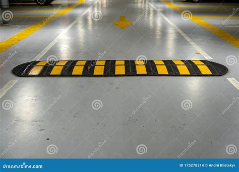 Striped Black And Yellow Speed Bump On A Road Stock Photo Image Of