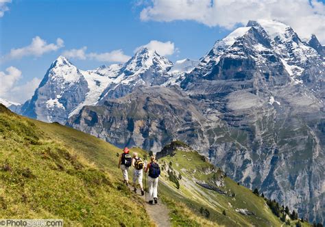 Three Women Hike Wasenegg Ridge Near The Peaks Of Eiger Mönch And