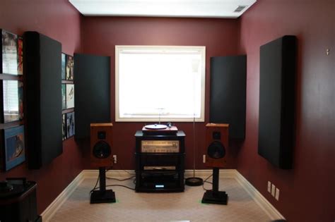 A Room With Red Walls And Speakers In It