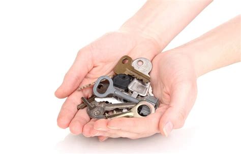 Premium Photo Many Keys In Hands Isolated On White