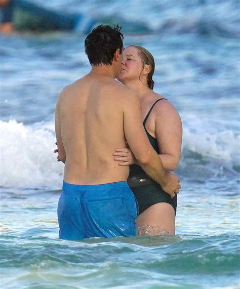 Amy Schumer and Husband Chris Fischer Share a Kiss in the Sea During