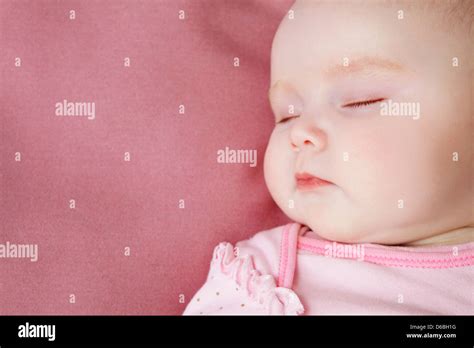 Baby Girl Sleeping In Bed Stock Photo Alamy