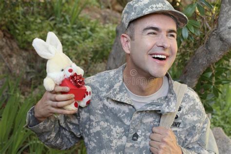 Army Soldier Back Home With Cute Ts For Loved Ones Stock Photo