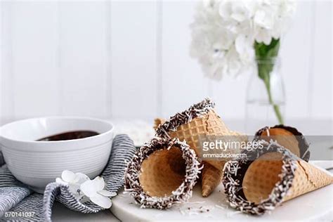 Chocolate Coated Ice Cream Cone Photos And Premium High Res Pictures