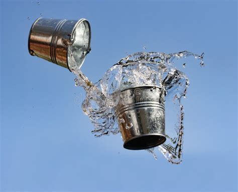 A Pouring Water From Falling Bucket To Bucket Stock Image Image Of