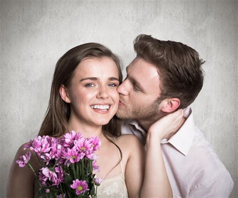 Man Kissing Woman As Holds Flower Stock Photos Free Royalty Free Stock Photos From Dreamstime