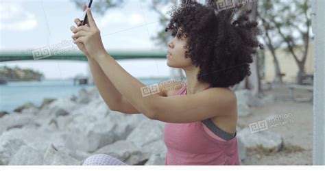 Casual Black Girl Taking Selfie On Riverside Stock Video Footage 11497592