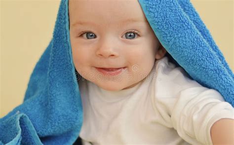 Smiling Baby Boy Covered By A Towel Stock Image Image Of Five Blue