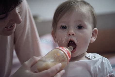 Little Baby Drinking Juice From Bottle Stock Photo Image Of Adorable