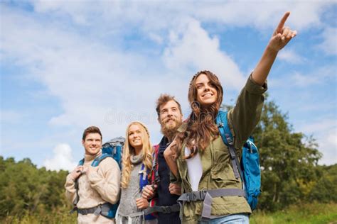 Group Of Smiling Friends With Backpacks Hiking Stock Photo Image Of