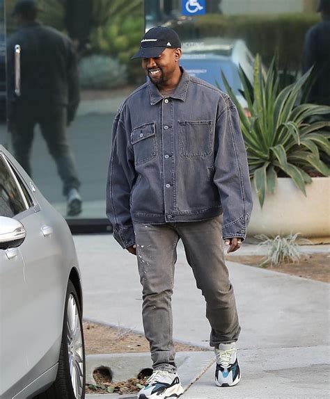 Kanye West In Balenciaga Denim Jacket X Yeezy Wave Runner 700 Grey