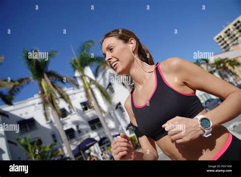 Jogger Woman Running In The Street Of Sunny City Stock Photo Alamy