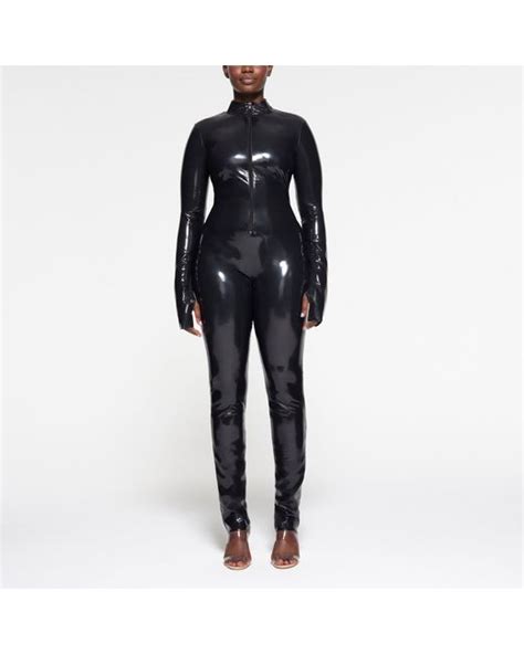 Skims Zip Front Catsuit Bodysuit In Black Lyst