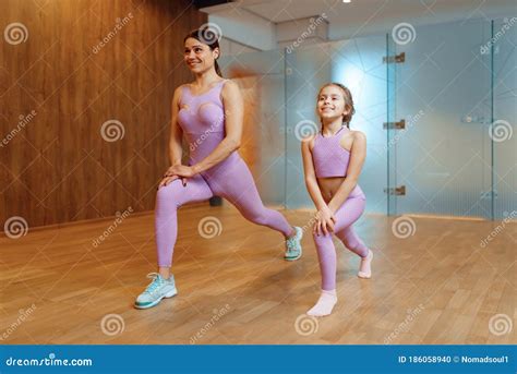 Mother And Daughter Doing Exercise In Gym Stock Photo Image Of