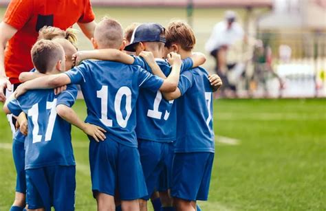 Children Playing Soccer Young Boys In Football Team Group Of Children