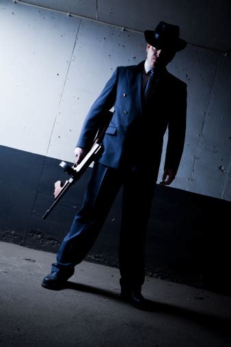 Old Style Gangster With Tommy Gun In Dark Setting Stock Photo
