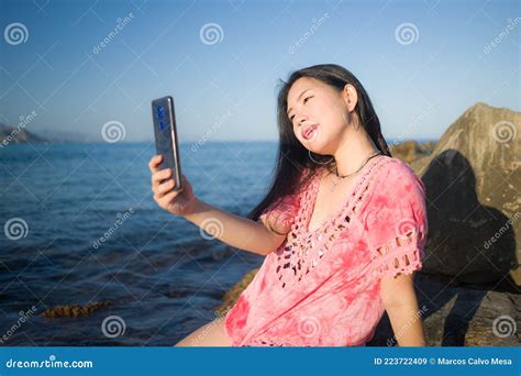 Young Happy And Beautiful Asian Woman Taking Selfie With Mobile Phone By The Sea Chinese Girl
