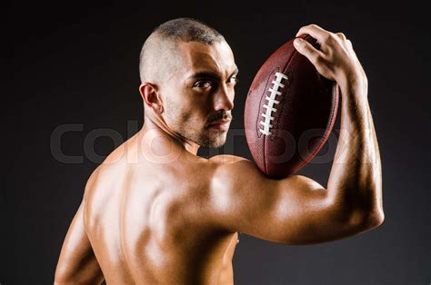 Muscular Football Player With Ball Stock Image Colourbox