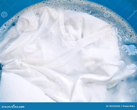 Wash White Clothes And Soak Cloth In Laundry Detergent Water In Tub