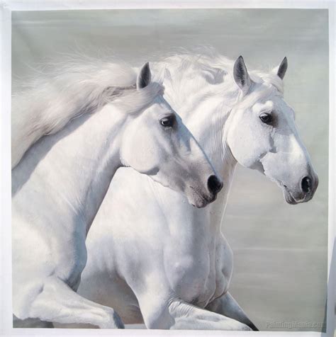 Two White Horses Standing Next To Each Other