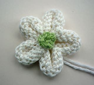 They are bloom around our house and inspired me to make them in the past, just for fun. Ravelry: Knitted Flower Tutorial pattern by Julie Taylor