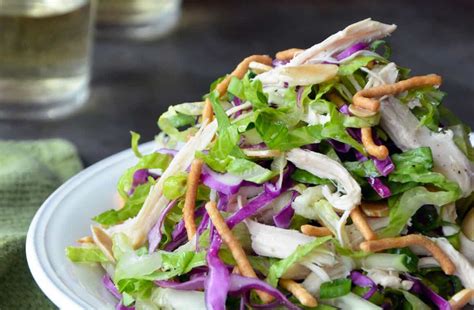 This crunchy chinese chicken salad is quick, refreshing and satisfying, loaded with crisp, vibrant veggies, crunchy wonton strips and nuts all doused in tangy sesame ginger dressing! Chinese Chicken Salad with Sesame Dressing | Just a Taste