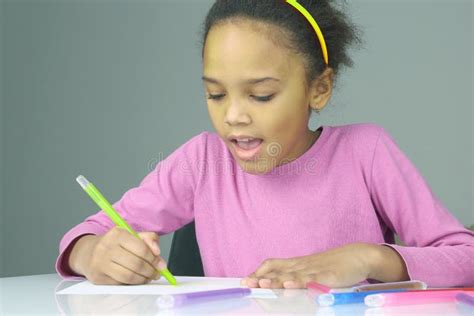 The Girl Draws A Pencil On White Paper Creativity Drawing In Childhood