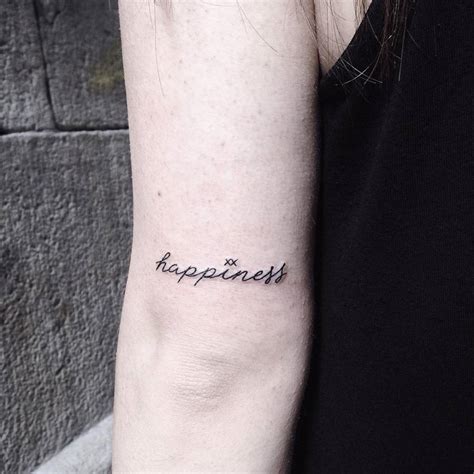 Happiness Tattoo On The Back Of The Left Arm