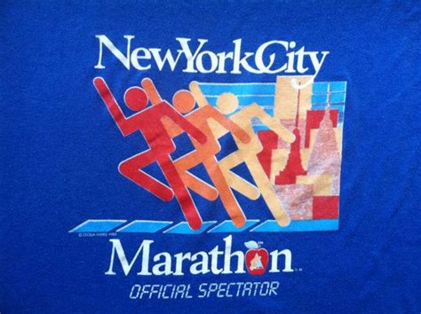 The New York City Marathon T Shirt Is Blue And Has An Image Of People
