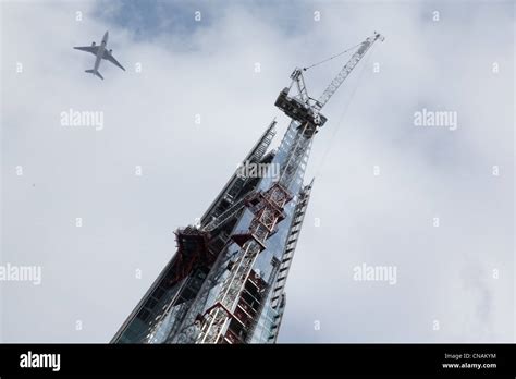 Jet Airliner Passes Above The London Shard Spire Stock Photo Alamy