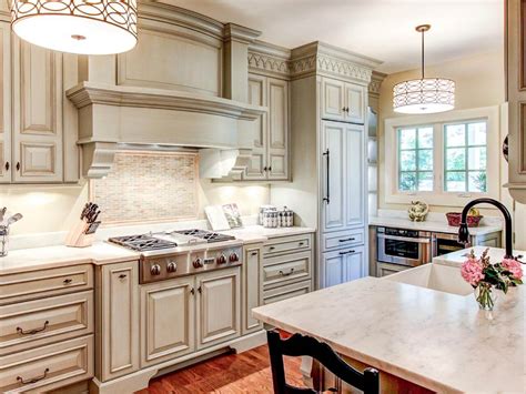 Get inspired by the spectacular kitchen cabinet designs only at fevicol design ideas. White Traditional Kitchen Cabinets - TheyDesign.net ...