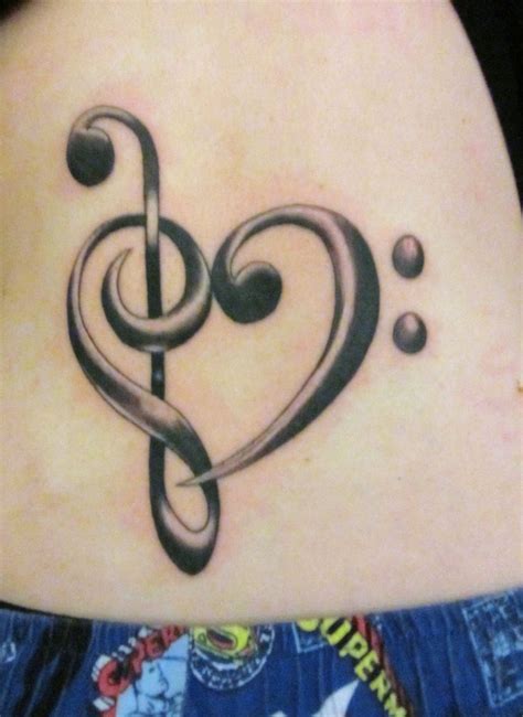 Amazing Music Inspired Tattoo Treble Clef And Bass Clef In The Shape