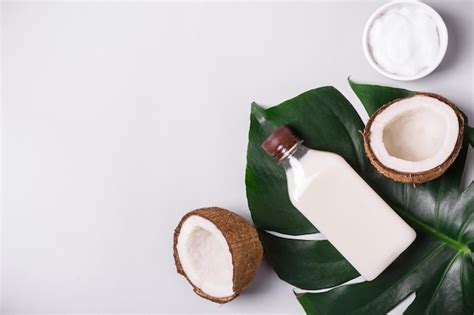 Premium Photo Coconut Oil And Tropical Leaves Natural Do It Yourself