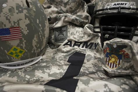Armys Camo Football Uniforms And Helmets