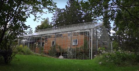 An Enormous Greenhouse Built Over A House Keeps It Balmy Year Round