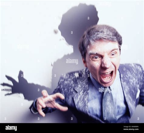 Frustrated Businessman Breaking Through Wall Stock Photo Alamy