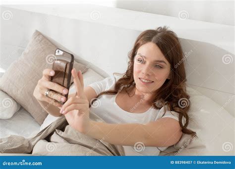 Female Taking Selfie Lying In Bed Stock Image Image Of Phone Self 88398407