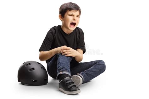 Boy Sitting And Holding His Hurt Knee Stock Image Image Of Sitting