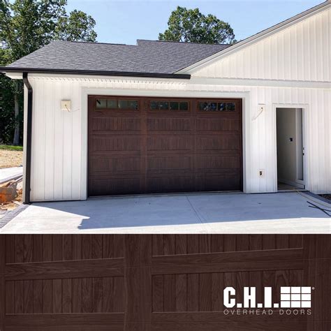 Faux Wood Stamped Carriage House Garage Door On White Exterior Walnut Carriage House Garage