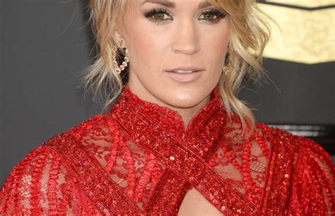 Blond Haired Seductress Carrie Underwood Looks Great In Her Red Dress