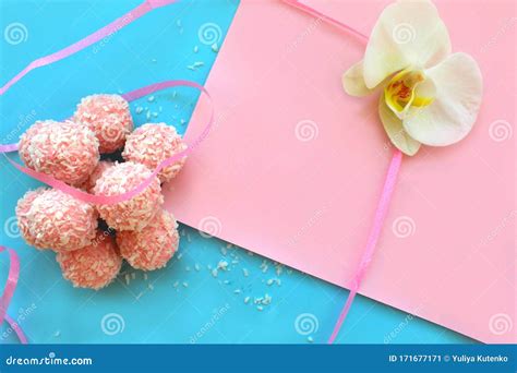 Pink Candies On A Blue And Pink Background Stacked In A Pile Stock