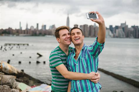 Gay Couple Taking A Selfie Against Manhattan Skyline By Simone Wave