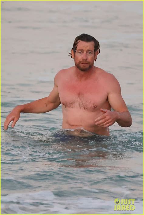 Simon Baker Goes For Dip In The Ocean While At The Beach With Son Harry