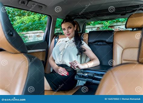Attractive Businesswoman Sitting On Back Seat Of A Car Stock Image Image Of Businesswoman