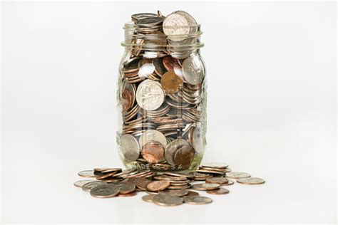 Fund jar that counts money. Money In A Glass Jar Stock Photo - Download Image Now - iStock