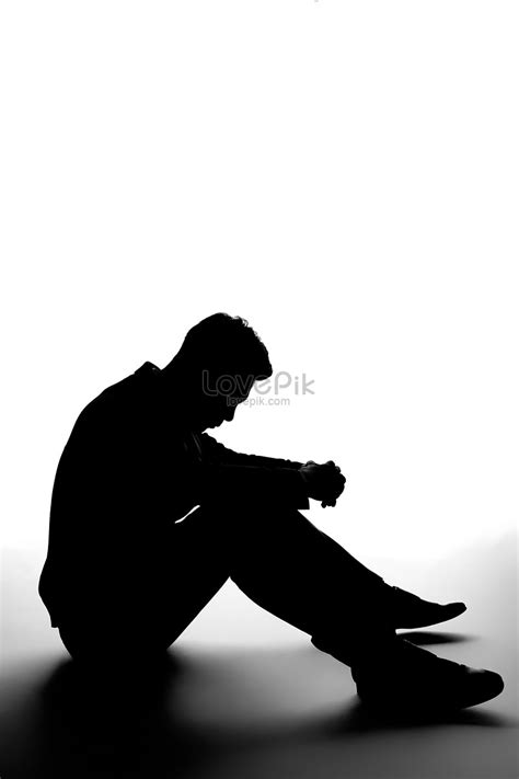 Lonely Male Sitting On The Ground Silhouette Picture And Hd Photos