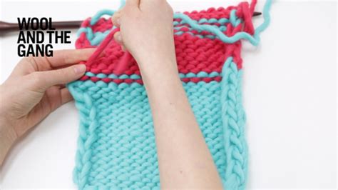 You can also do intarsia where you keep the different colors on bobbins as you work the join when knitting in the round. How to join a new ball of yarn | Knitting | WOOL AND THE GANG
